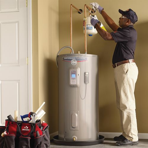 Picture of a new electric water heater being installed