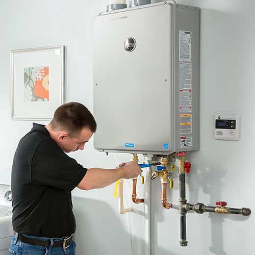Picture of a new tankless water heater being installed